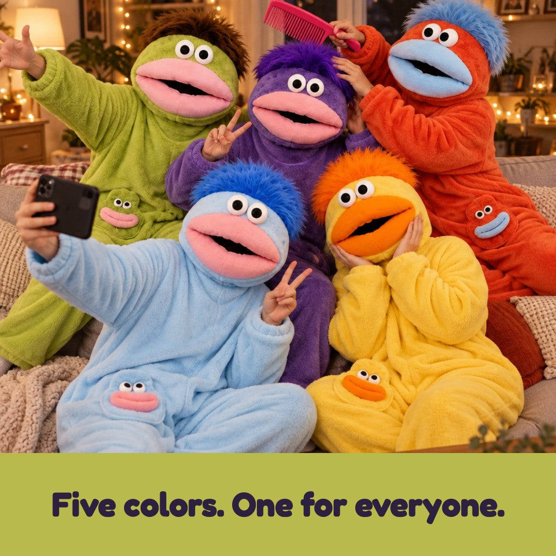 Five friends on a couch wearing all five monster onesie colors
